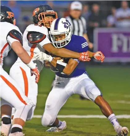  ?? STAFF PHOTO BY ROBIN RUDD ?? South Pittsburg’s Jabron Hale sacks Marion County quarterbac­k Isaiah Sampson for a safety early in the Pirates’ 56-18 win Friday night in Jasper.