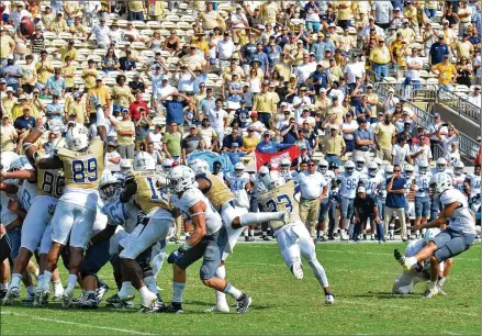  ?? HYOSUB SHIN / HYOSUB.SHIN@AJC.COM ?? Citadel kicker Jacob Godek hits the winning 37-yard field goal in overtime Saturday at Bobby Dodd Stadium. Brenton King had missed a 46-yard attempt during Georgia Tech’s possession in overtime.