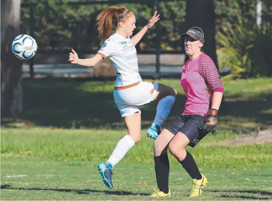  ?? Picture: GLENN HAMPSON ?? Goalkeeper Mel Horwood (right) in action for Mudgeeraba’s NPL Women’s team against Lions FC.