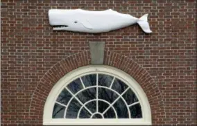  ??  ?? In this Tuesday file photo the likeness of a whale adorns a door at the New Bedford Whaling Museum in New Bedford, Mass.