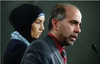  ?? TheCanadia­nPress ?? Canadian Muslim Forum spokespers­on Samah Jebbari, left, listens as forum president Samer Majzoub responds to a question during a news conference Tuesday on Parliament Hill in Ottawa.