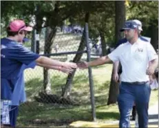  ?? KATHY KMONICEK — THE ASSOCIATED PRESS ?? Ryan Moore high-fives with fans on his way to the 15th tee during the second round of The Barclays golf tournament in Farmingdal­e, N.Y., Friday.