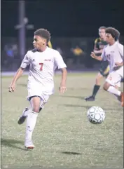  ?? STAFF PHOTO BY COLIN STOECKER ?? North Point senior striker Austin Weeks dribbles the ball in Tuesday night’s SMAC contest against Great Mills. Weeks scored one of the two Eagles goals in a 3-2 overtime loss.