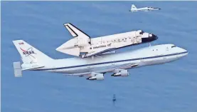  ?? AP ?? The U.S. space shuttle famously flew on top of a modified Boeing 747. The first version originally flew for American Airlines.