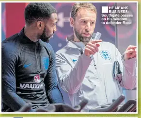 ??  ?? ■HE MEANS BUSINESS: Southgate passes on his wisdom to defender Rose
