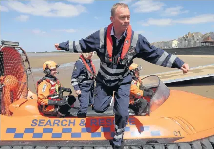  ??  ?? > Tim Farron steps off a search and rescue boat as he campaigns at a volunteer-run service at Burnham-on-Sea
