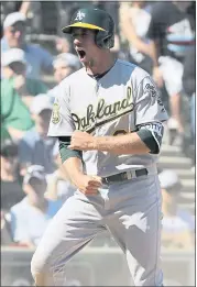  ?? NAM Y. HUH — THE ASSOCIATED PRESS ?? Stephen Piscotty of the A’s scores on a single by Nick Martini during the eighth inning against the White Sox.