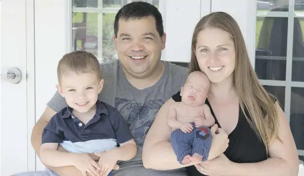  ??  ?? Steve Beck and Ashley Beck with their children Daxton, 3, and Blayne, eight months, at their Hay River, N.W.T., home. Blayne was born significan­tly premature, forcing the family to stay in Edmonton while he received life-saving medical care.