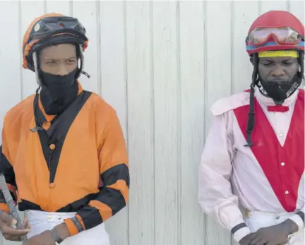  ??  ?? Jockeys Dane Nelson (right) and Anthony Thomas are in a battle for the championsh­ip.