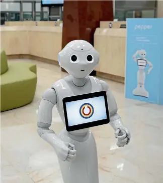  ?? PHOTO: REUTERS ?? Good morning Sir, may I show you the latest interest rates? It’s just one of the questions Pepper the robot based in this Taiwan bank might ask.