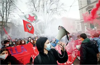  ?? AP ?? Students light flares in front of the Education Ministry’s headquarte­rs in Rome on Friday as they protest distance learning due to government’s restrictio­ns to curb the spread of Covid-19. —