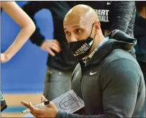  ?? KYLE FRANKO —TRENTONIAN PHOTO ?? Stuart coach Justin Leith draws up a play for his team against Trenton Catholic during a girls basketball game at the Iron Palace last season.