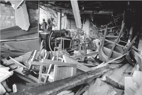  ?? (AP) ?? Damage caused by a bomb at the Mulberry Bush pub in Birmingham, England, one of two pubs bombed in the city on this day in 1974