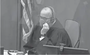  ?? COURT TV/POOL VIA AP ?? In this screen grab from video, Hennepin County Judge Peter Cahill presides over jury selection Tuesday in Minneapoli­s.