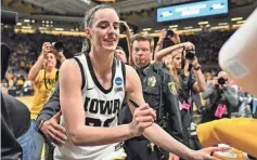  ?? JEFFREY BECKER/ USA TODAY SPORTS ?? Iowa guard Caitlin Clark signs after the NCAA secondroun­d game against West Virginia.