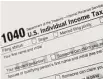  ?? Mark Lennihan / Associated Press ?? 1040 Tax Form U.S. Individual Income Tax Return