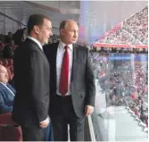  ?? ALEXEI DRUZHININ/ AP ?? Russian President Vladimir Putin ( right) and Russian Prime Minister Dmitry Medvedev check out the scene during the World Cup opener.