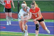  ?? GENE WALSH — DIGITAL FIRST MEDIA ?? Upper Moreland’s Mary Grace Wood battles Upper Dublin’s Mack Moore for possession Monday night.