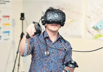  ?? PHOTO: GREGOR RICHARDSON ?? Unique insights . . . Dunedin Hospital neurosurge­ry house officer Glen Rawlinson examines nerve tissue closeup with the aid of virtual reality rendering.