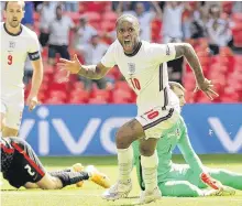  ?? REUTERS ?? England’s Raheem Sterling celebrates scoring the team’s first goal of Euro 2020, giving the side a 1-0 win over Croatia in front of a hometown crowd in Group D action at Wembley Stadium in London on Sunday.