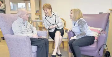  ??  ?? Warm welcome Resident Clarence Stevenson, 88, and his daughter Sharon Farmer chat with First Minister Nicola Sturgeon