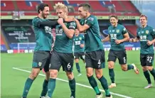  ??  ?? Burnley players celebrate Ben Mee’s winner against Crystal Palace