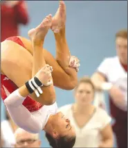  ?? NWA Democrat-Gazette/CHARLIE KAIJO ?? Arkansas’ Amanda Wellick dismounts from the uneven bars in a meet earlier this season at Barnhill Arena. Wellick, a two-time All-American on the vault, has 33 career event titles and has been solid this season after returning from surgery on her...