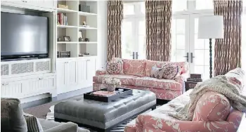  ?? Sarah Dorio/ The Ass ociated Press ?? Pink is a bold choice for the couches in this family room by Burnham Design, but liberal use of white, grey and brown stops it from being over the top.