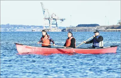  ?? NIKKI SULLIVAN/CAPE BRETON POST ?? Andrea Currie, from left, of Port Hood, Robert Pictou of Vancouver, and Danny Paul of Membertou take a symbolic canoe ride in Sydney harbour on Sunday as part of the opening of national inquiry into missing and murdered Indigenous women and girls. They...