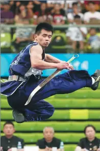  ?? WANG ZHUANGFEI / CHINA DAILY ?? A wushu athlete competes at the Chinese National Games in Tianjin.