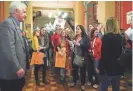  ?? MICHELLE GUTIERREZ/THE REGISTER ?? Supporters of Area Education Agencies wait in a Capitol hallway Feb. 21 as lawmakers leave a public hearing on the House version of a bill to overhaul the state’s AEAs.