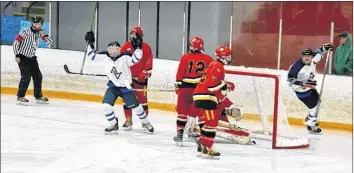  ?? COLIN CHISHOLM ?? Jacob Caldwell scores on the Sir John A. Flames net during the Birthplace of Hockey Tournament.