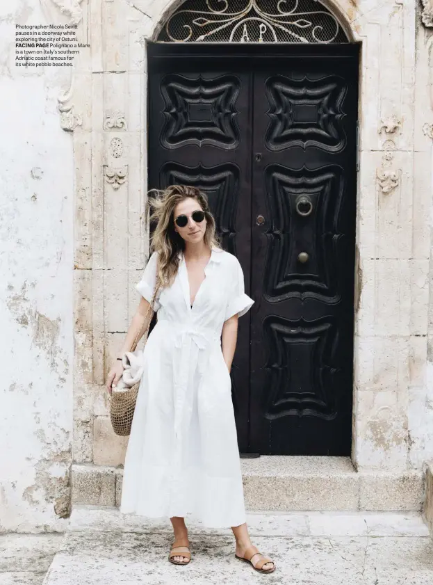  ??  ?? Photograph­er Nicola Sevitt pauses in a doorway while exploring the city of Ostuni. FACING PAGE Polignano a Mare is a town on Italy’s southern Adriatic coast famous for its white pebble beaches.