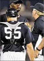  ??  ?? Michael Pineda tries to cope with shoulder pain Friday night and queries by pitching coach Larry Rothschild and catcher Russell Martin. Photo by AP