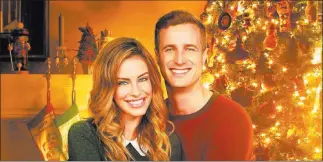  ??  ?? Hallmark Channel Jessica Lowndes and Brendan Penny in the Hallmark movie “Magical Christmas Ornaments.”