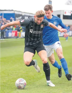  ?? Peter Hilton Photograph­y ?? Action from Macclesfie­ld’s clash against Northampto­n Town at the Moss Rose