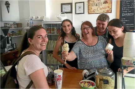  ??  ?? Poppy’s Homemade Ice-cream and Cafe owners Karen and Bruce Barwick, middle, and staff Gemma Spencer and Jessie Stuart are excited to see the town return to normal with the reopening of SH1 north.