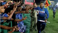  ?? PTI ?? Sri Lankan cricket fans cheer Tillakarat­ne Dilshan, who played his last ODI against Australia in Dambulla on Sunday. —
