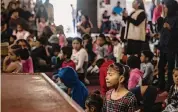  ?? Karen Castaneda/Associated Press ?? A young migrant prays Tuesday during a service at a migrant shelter in Tijuana, Mexico.