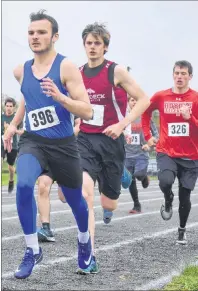  ?? JEREMY FRASER/CAPE BRETON POST ?? Brandon Martin, left, of Sydney Academy leads the pack while Chance Blackstone of Baddeck Academy, middle, and Ethan Merlin of Riverview High School follow close behind during the 1,500-meter senior boys run during the Highland Region track and field...