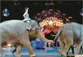  ?? ALEX BRANDON/AP ?? Elephants walk during a 2015 performanc­e of the Ringling Bros. and Barnum & Bailey Circus in Washington. Ringling Bros. is returning after six years, without elephants or other animal acts.