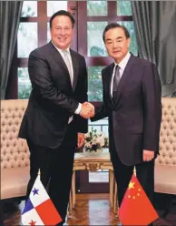  ?? DAN HANG / XINHUA ?? Visiting Foreign Minister Wang Yi meets Panamanian President Juan Carlos Varela on Saturday in Panama City.