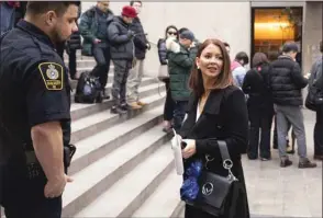  ??  ?? Sarah Leamon, a member of the Huawei Technologi­es legal team applying for bail for Huawei CFO Meng Wanzhou, speaks to a sheriff at BC Supreme Court prior to the start of proceeding­s in Vancouver, Canada.