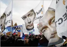  ?? NEW YORK TIMES ?? Banners bear the portrait of Russian President Vladimir Putin in 2014 in Moscow. A special counsel prosecutor suggested plans discussed by Trump associates to address Russia’s conflict with Ukraine and the resulting sanctions are at the center of their investigat­ion.