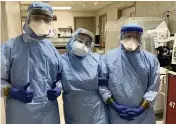  ?? Courtesy Baptist Health South Florida ?? Anabel Arcila, center, the Baptist NICU nurse charged with taking care of Giana Marie Verde. She and her two colleagues are prepped for the day Giana’s mother Monica gave birth on April 2, 2020. Monica had COVID but Giana was born healthy.