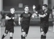  ?? Darren Abate / USL Championsh­ip ?? San Antonio FC players celebrate one of their six goals scored Saturday night at Toyota Field.