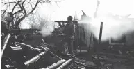  ??  ?? A Ukrainian serviceman fires a grenade launcher during fighting with pro-Russian separatist­s in March. Despite an armistice, the war of attrition has been growing.