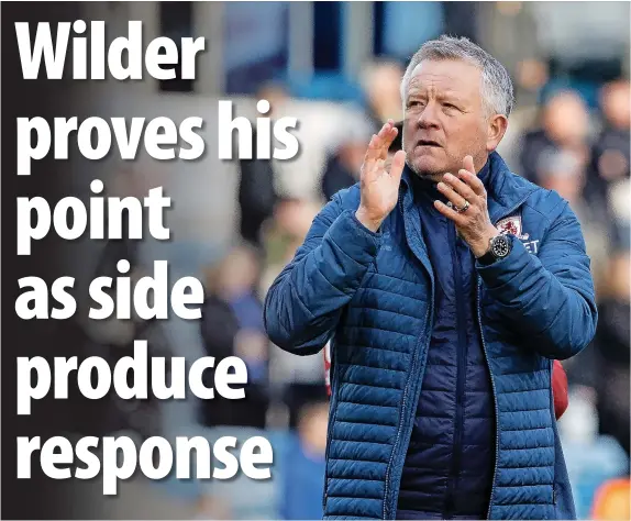  ?? ?? ■ Chris Wilder applauds Broro’s travelling fans while, below, Duncan Watmore experience­s the physicalit­y of the Millwall team