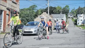  ?? CAROL DUNN/THE NEWS ?? Michelle Young of Pictou Recreation and Parks leads the Women on Wheels group down a Pictou street on Friday, on their way to the Jitney Trail for a ride. Special guest Allan Collie, who spoke to the group beforehand, joined them.