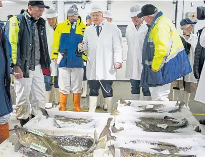  ?? Pictures: PA. ?? Clockwise from top: The prime minister during a visit to Darnford Farm, Banchory; with Scottish Secretary Alister Jack; and at Peterhead’s fish market.